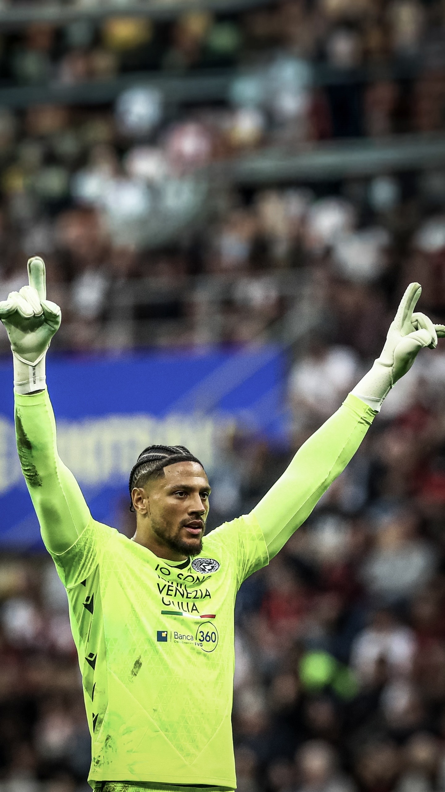 Okoye celebrating with arms raised